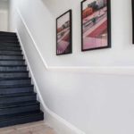 oiled-victorian-pine-floorboards-with-striking-black-staircase
