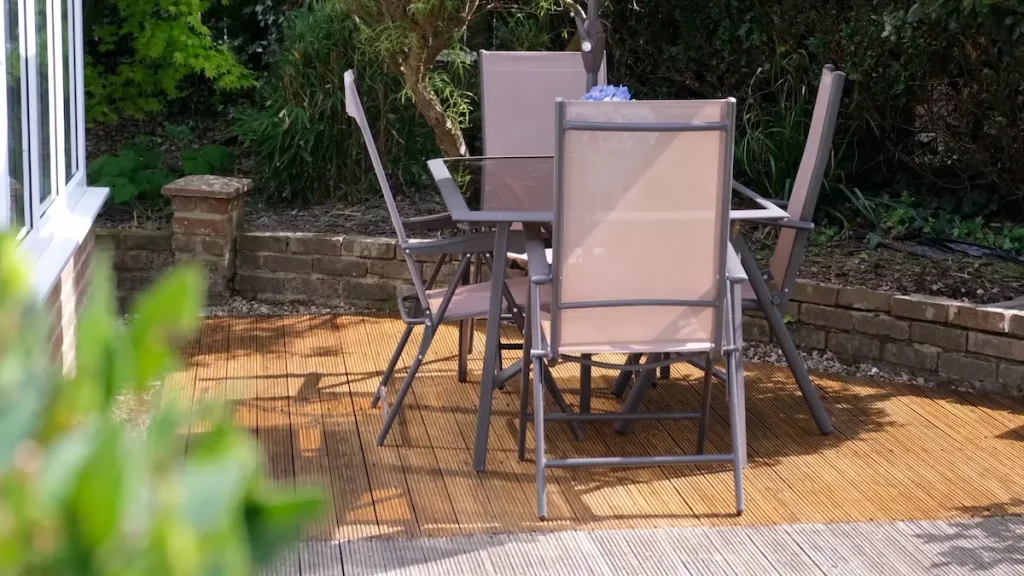 Oiled decking showing a before and after comparison.