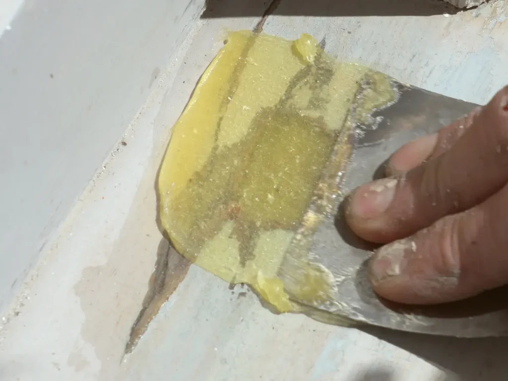 Applying Repair Care Dry Flex to a section of timber